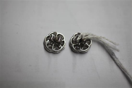 A pair of platinum and diamond seven-stone cluster ear studs, 12mm.
